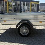 ALFA 12013MN.75L egytengelyes, 2,0x1,25m méretű, 750kg fék nélküli, laprugós mellsőkerekes fix oldalfalas nyitott utánfutó