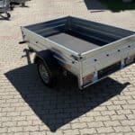 ALFA 12013MN.75L egytengelyes, 2,0x1,25m méretű, 750kg fék nélküli, laprugós mellsőkerekes fix oldalfalas nyitott utánfutó