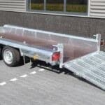 ALFA-T 440180MVG.270/L kéttengelyes, fékezett, alsókerekes, síkplatós, gépszállító utánfutó, tréler felhajtó rámpával