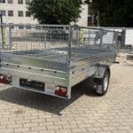 ALFA-B 23015MN.100-ig egytengelyes, 2,94x1,44m méretű, 1000kg fékezett mellsőkerekes fix oldalfalas utánfutó RÁCCSAL