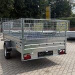 ALFA-B 23015MN.100-ig egytengelyes, 2,94x1,44m méretű, 1000kg fékezett mellsőkerekes fix oldalfalas utánfutó RÁCCSAL