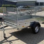 ALFA 12513MN.75 egytengelyes, 2,44x1,25m méretű, 750kg fék nélküli, mellsőkerekes fix oldalfalas nyitott utánfutó RÁCCSAL